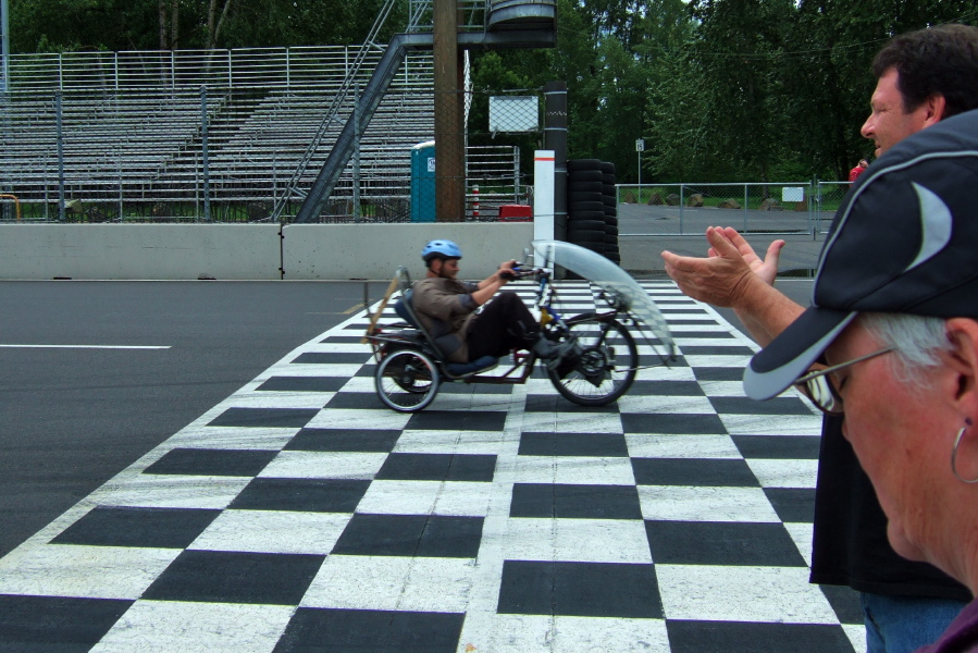 Michael Reiss on his FWD delta trike finishes a lap.