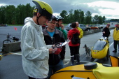 Bill reads, then signs, the track liability waiver.