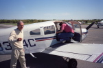 Getting into the plane.