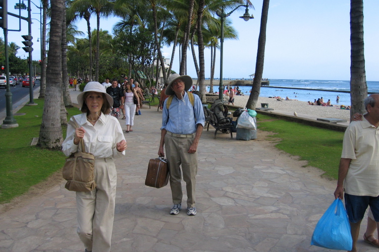 Mom and Dad walk to Dad's hotel room along Waikiki Beach.