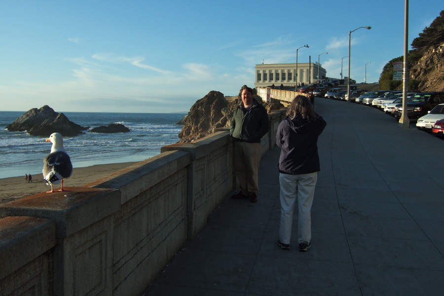 Lisa photographs Len near the Cliff House.