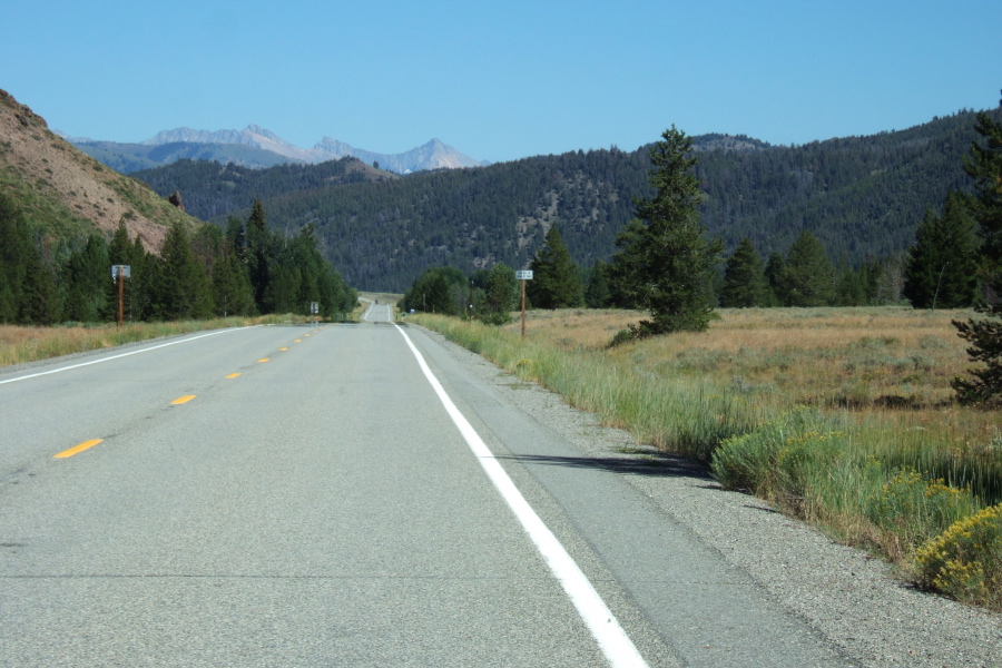 The road descends for many miles until it hits the short uphill in the distance of this photo.
