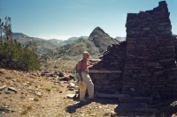 David explores one of the old miner's cabin ruins.