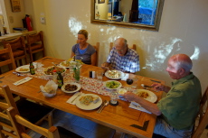 Laura, David, and Brian at the dinner table