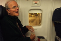 David enjoys his dinner of trail mix before the plane leaves the gate.