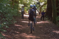 Bill photographs two ladies on unicycles.