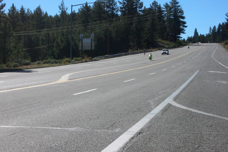 Bill approaches the left turn onto CA158 (June Lake Junction); Ron Bobb follows. (7690ft)