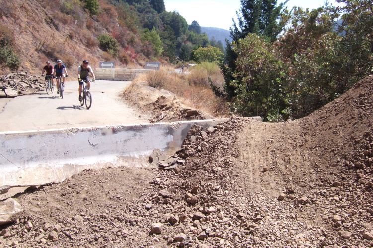 Cyclists riding through from the southern end of the closure.