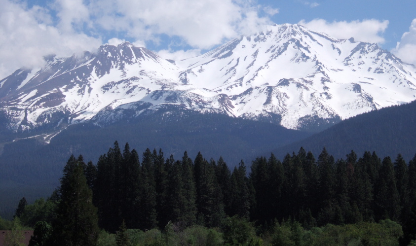 Mt. Shasta's clouds break up briefly.