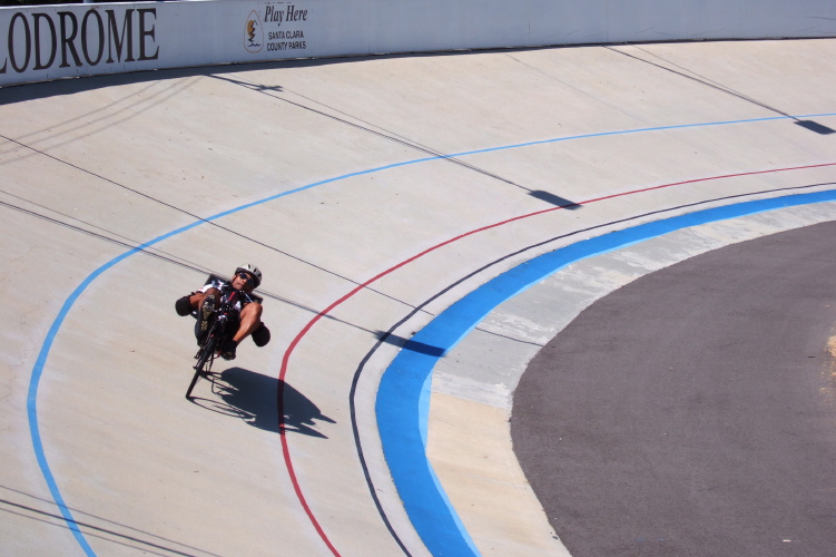 Rider on low racer prepares for the final sprint.