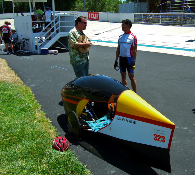 Rick Valbuena (r) and his very nicely made coroplast fairing w/canopy on a Catrike.