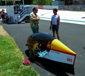 Rick Valbuena (r) and his very nicely made coroplast fairing w/canopy on a Catrike.