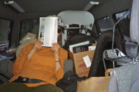 Kay sits in the captain's chair.