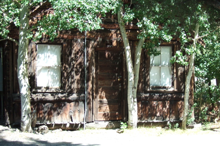 Old cabin at the Silver Lake Resort on a log foundation.