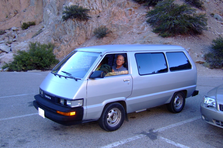 Alice and David relax at the van.