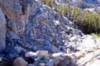 The trail traverses a crumbling wall.