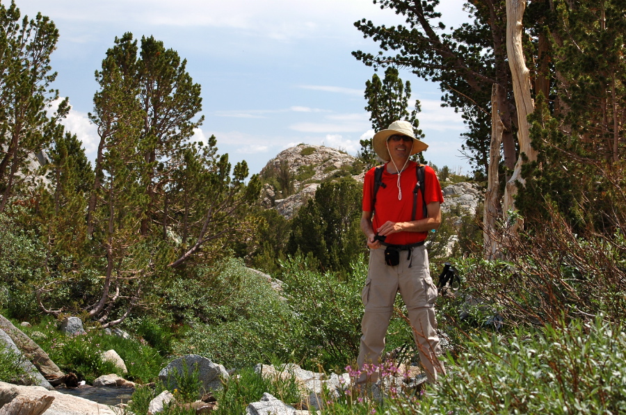 Bill stands next to Lamarck Creek.