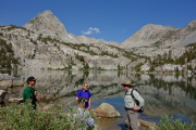 Stopping to chat with a fisherman (seated) and his son at Lower Lamarck Lake