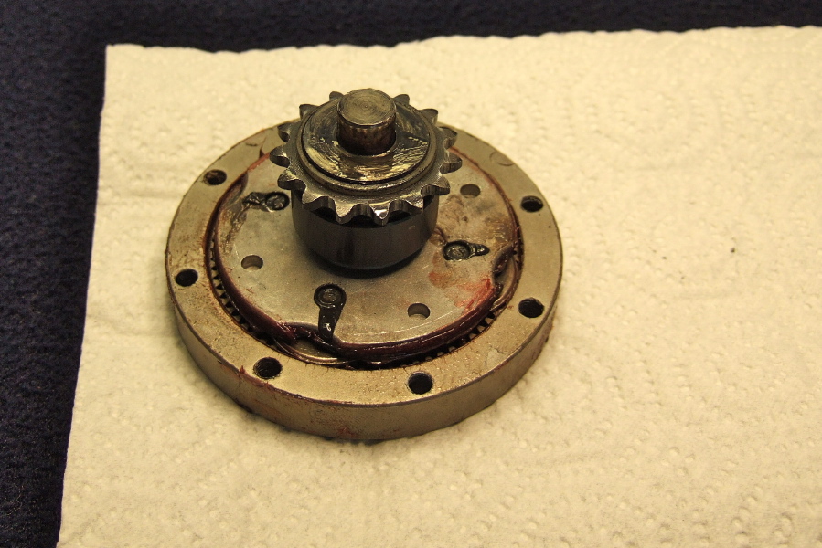 Washer and spacer positioned on output sprocket