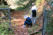 Stopping at the cyclone gate to adjust shoes.