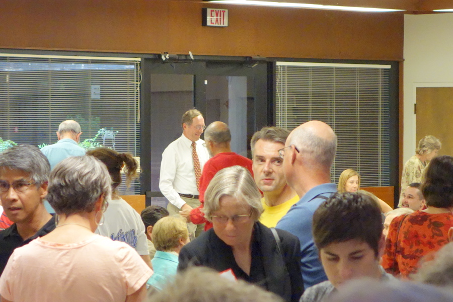 Thomas Maslen (facing camera) and Don Burnett talk.