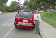 Zach stands next to Lee's Bike Van.