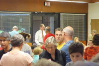 Thomas Maslen (facing camera) and Don Burnett talk.