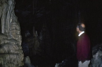 David enjoys one of the large auditoria in the Lehman Cave.