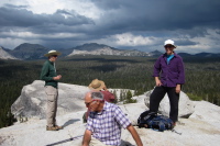 Padre Bill, David, Ron, and Stella enjoy the view from Lembert Dome.
