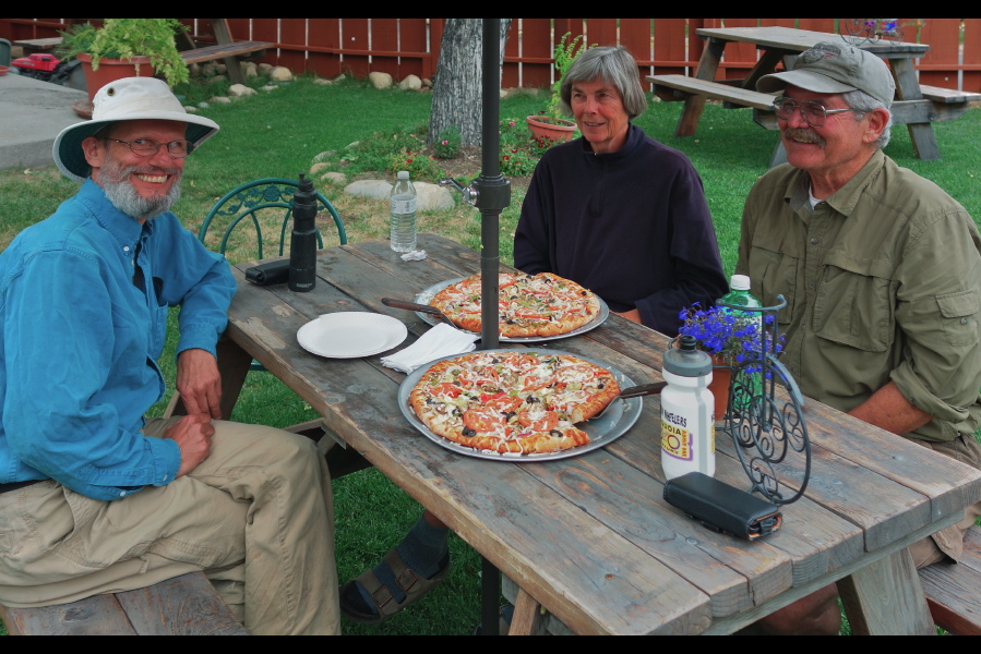 We prepare to dig into our pizza dinner.