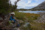 Frank eats lunch near Chickenfoot Lake.