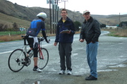 Russell Stevens and Howard Kveck (r) check in a rider at the finish.