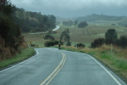 Gary Griffin descends to the tricky corner at CA25 and Coalinga Road (in the background).