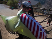 Bill carries his bike through the barrier.