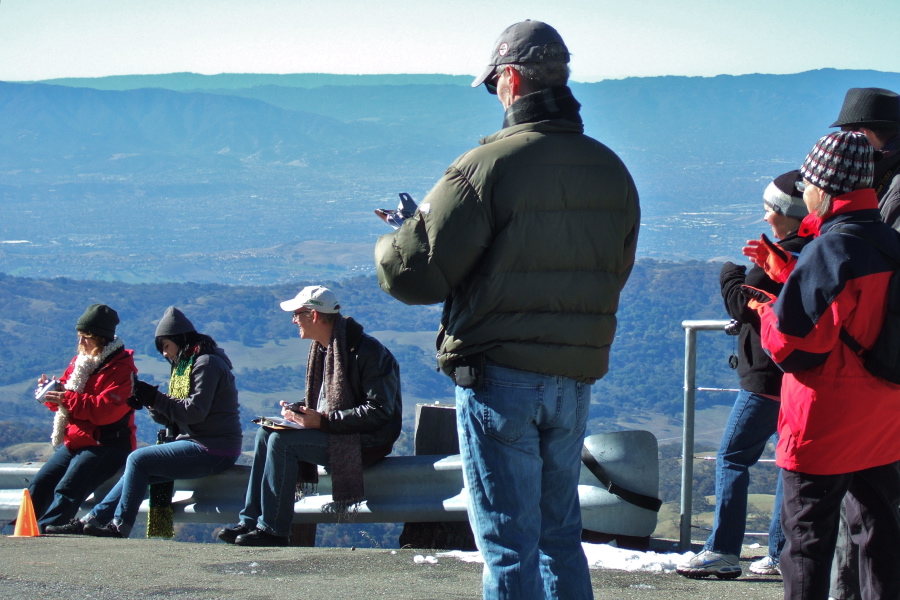 Finish line crew welcomes one of the later arrivals.