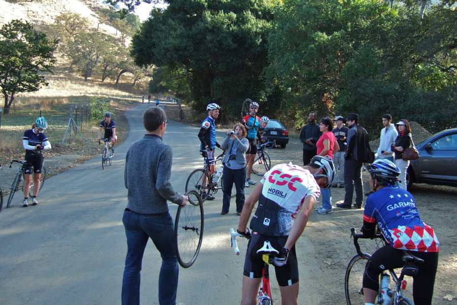 Shance gets a new front wheel while this week's volunteers wait to start the proceedings.