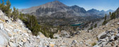 Mt. Morgan (13748ft) stands across Little Lakes Valley below.   Frank sits on a stable rock at the left while I explore the possibility of climbing up this stuff.