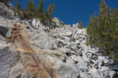 All of this stuff is loose and easily sent sliding or tumbling.  Neither fun nor safe.  Perhaps the guide books (Secor and Smatko) intend this peak to be climbed on winter snows.