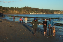 The group progresses beneath the cliffs.