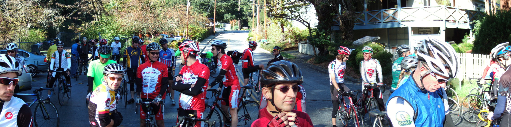 Cyclists form into a queue of sorts prior to setting off in small groups to climb Alba Rd.