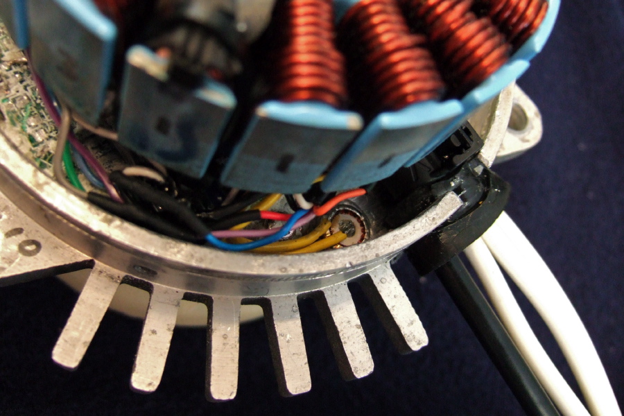 Temperature switch glued to chassis next to wire entry.