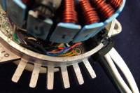 Temperature switch glued to chassis next to wire entry.