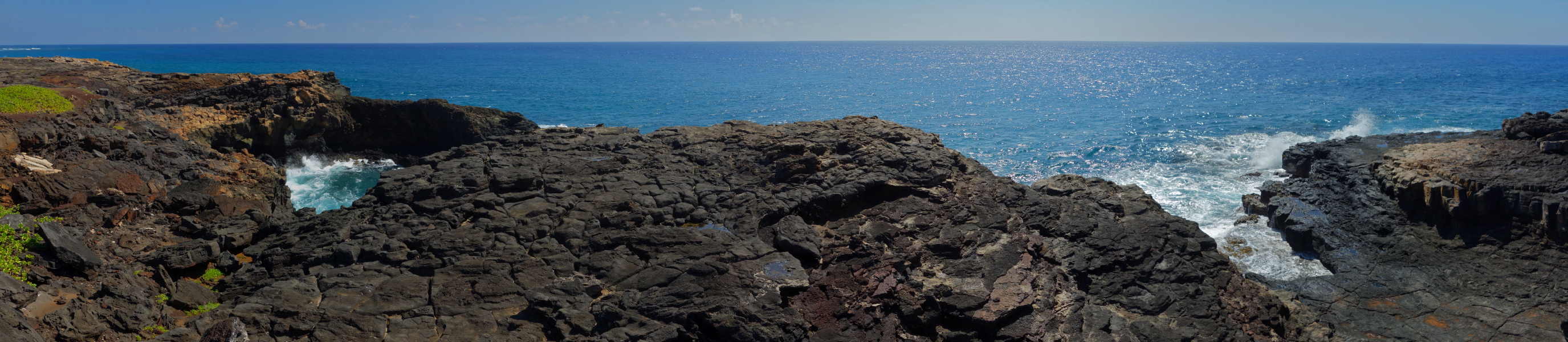 The surf beats against this lava shelf at Makahuena Point.