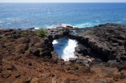 Lava arch over the sea at Makahuena Point
