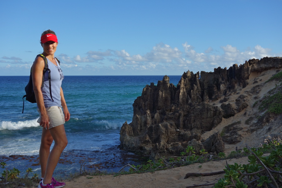 Laura models the sandstone pillars on Makawehi Point.