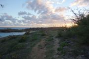 Laura starts the hike back into the rapidly-setting sun.