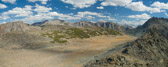 Stella is standing in the valley while Frank is climbing on the pinnacle at the right.