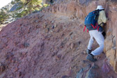 The slope to the left leads to the top of cliffs below, so a slip could be injurious or deadly.