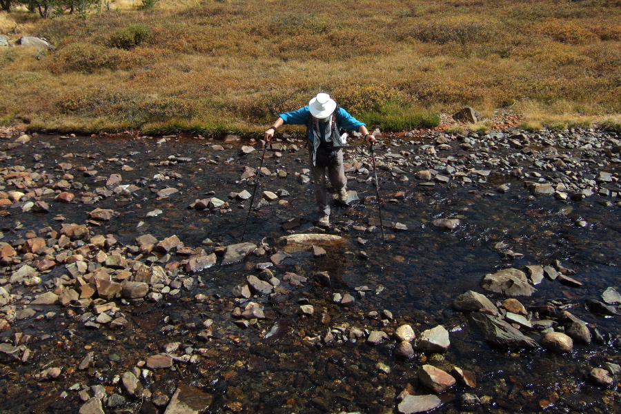 Frank makes his way across Parker Pass Creek.