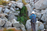 Frank photographs the small waterfall on the stream.
